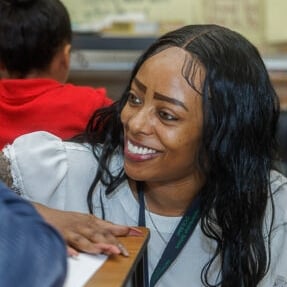 Abstract pink and purple ribbon shapes on a dark blue background