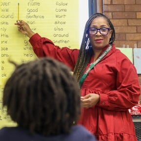 Abstract pink and purple ribbon shapes on a dark blue background