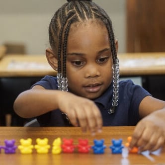 Abstract pink and purple ribbon shapes on a dark blue background