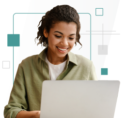 Individual holding a laptop and smiling 