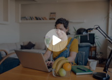 a woman using her computer at a desk