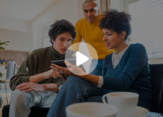 a family looking at an ipad