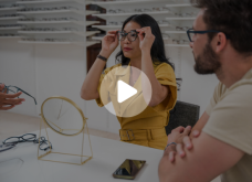 a lady trying on glasses