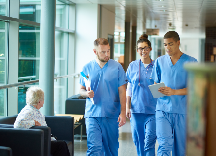 hero image of two nurses talking to one another