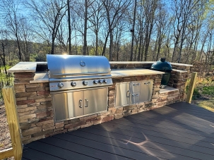 grill surround with grill and green egg