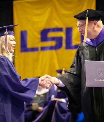 LSU Graduate receiving diploma