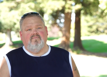 Couple seated in a Joe Homebuyer office sharing their home-selling experience.