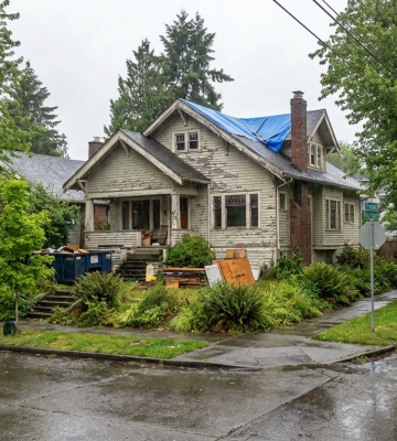 Aerial view of Phoenix neighborhoods with downtown skyline and mountains in the background.