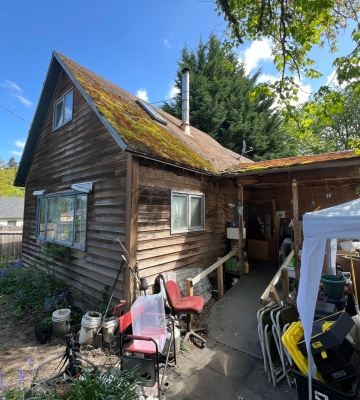 Aerial view of Phoenix neighborhoods with downtown skyline and mountains in the background.