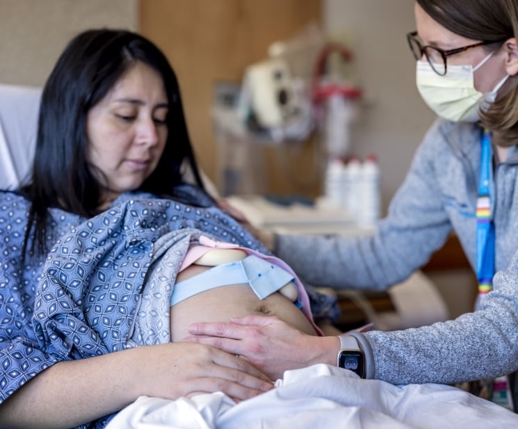 Pregnant woman in labor cared for by a nurse-midwife