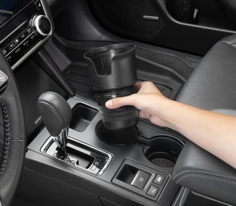 Man installing CupCoffee in a vehicle.