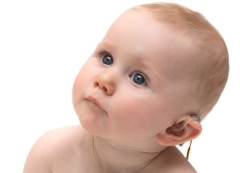 baby wearing hearing aid image