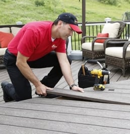 Handyman repairing a deck