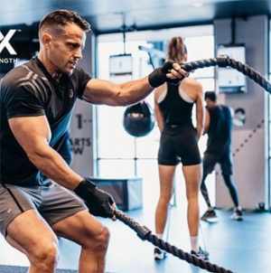 Man working out with ropes 
