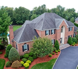 Luxury home with manicured landscaping 