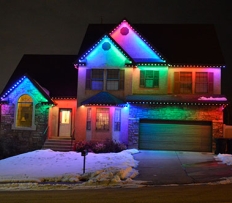 Two story house with rainbow led lights