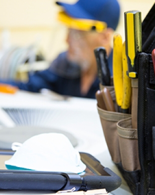 Technician repairing an A/C unit