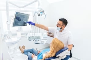 Dentist explaining tooth x-rays