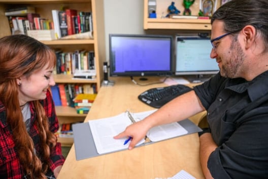 Professor working with student