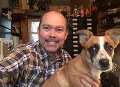 Sewing Machine repair specialist with their dog