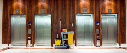 Clean lobby with 4 elevators 