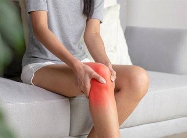 Person holding their hurting knee