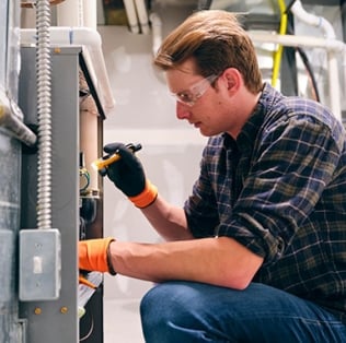 Technician working on furnace