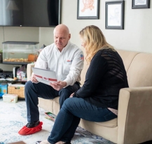 Technician going over paperwork with homeowner