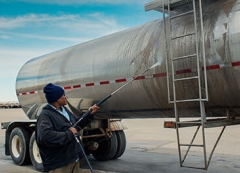 Person washing trailer 