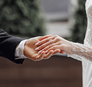 Bride and groom holding hands