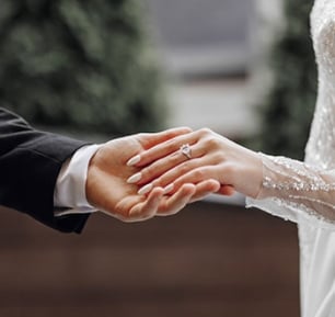 Bride and groom holding hands