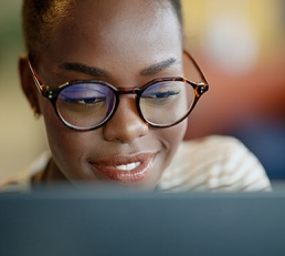 Woman looking at laptop screen