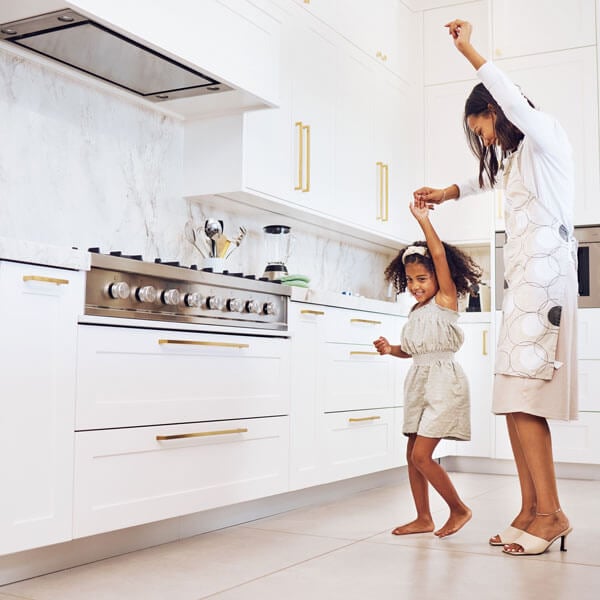 Women talking in a staged kitchen