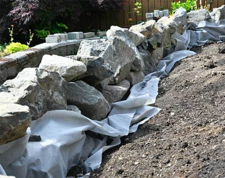 Rock wall being installed