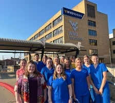 Group of nurses outside building
