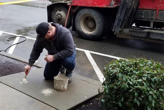 Person working on leveling concrete