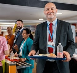 Educator holding a tray of food