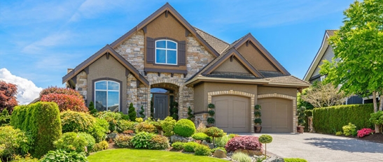 Front view of luxury home with impressive landscaping
