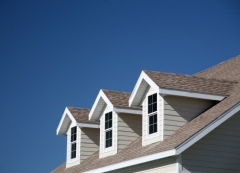 Photo of asphalt roof with dormers