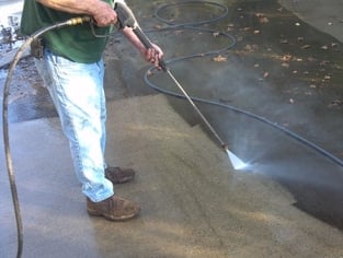 Power washing a driveway