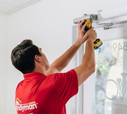Person working on commercial door