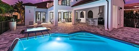 Outdoor pool lit up at night image