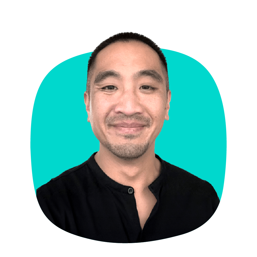 Jason Rahlan headshot on yellow shape
