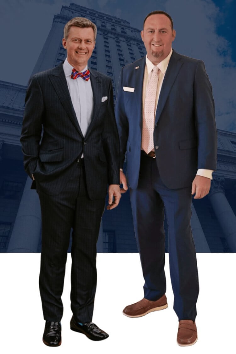 Lawyers Joshua Sabert Lowther, Esq. and Murdoch Walker II, Esq. in front of courthouse