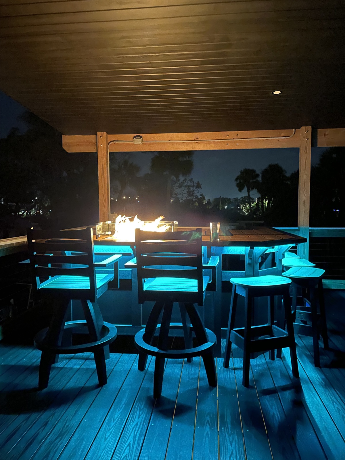 Covered upper-deck fire-table gathering space