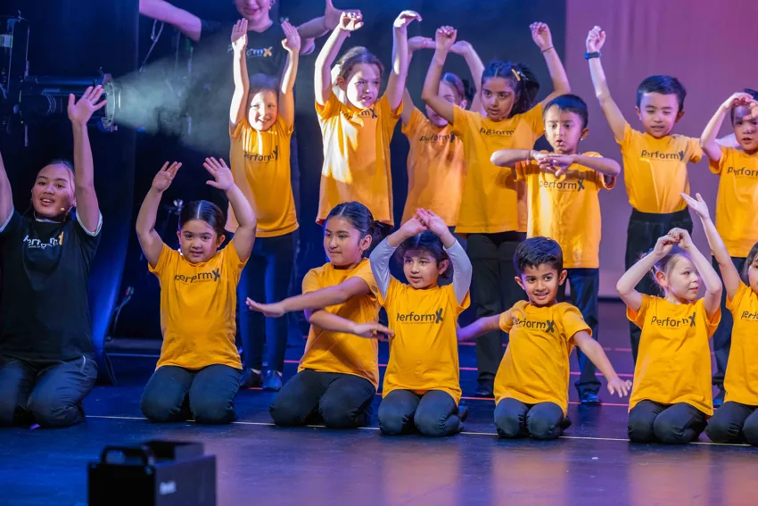 PerformX Academy students and mentor performing together