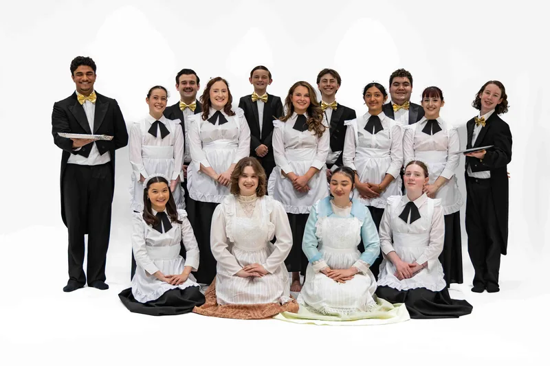 The mansion company together in formal uniforms