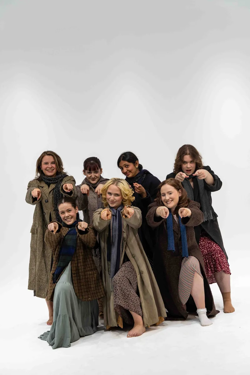 The Hooverville cast in a playful group pose