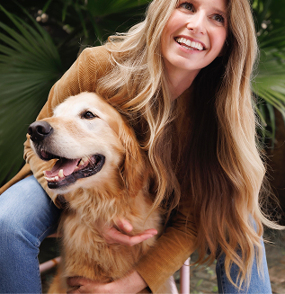 woman and golden retriever