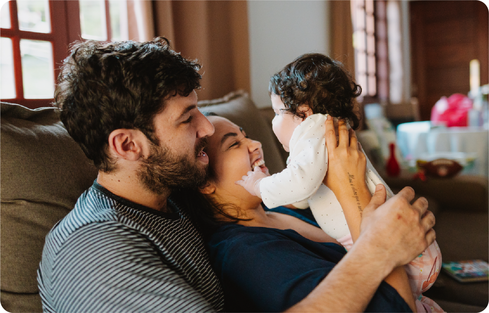Young family on couch at home